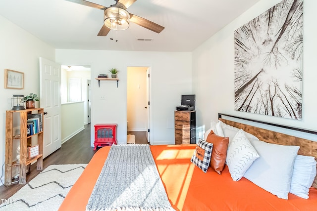 bedroom featuring dark hardwood / wood-style flooring and ceiling fan