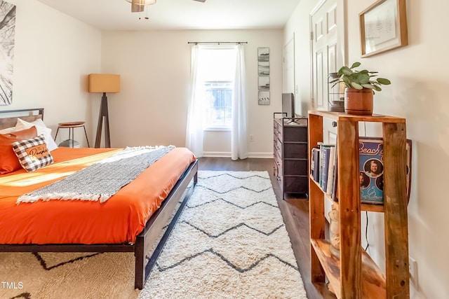 bedroom featuring ceiling fan and dark hardwood / wood-style floors