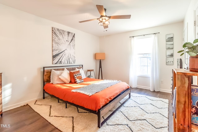 bedroom with hardwood / wood-style floors and ceiling fan