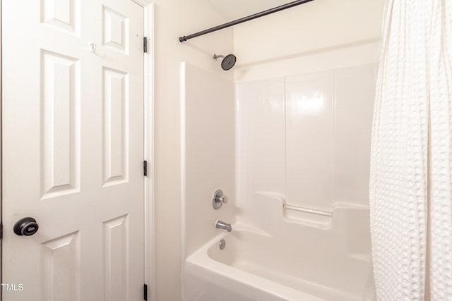 bathroom with shower / bath combination with curtain