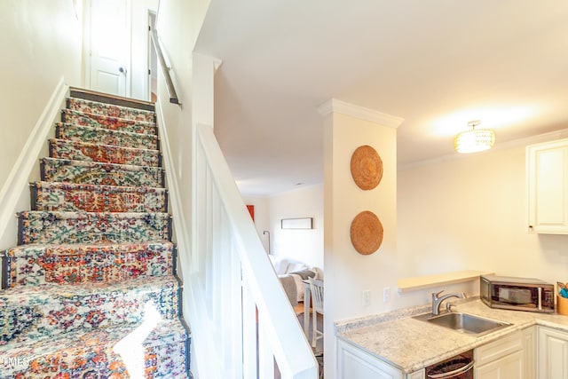 stairway with ornamental molding and sink