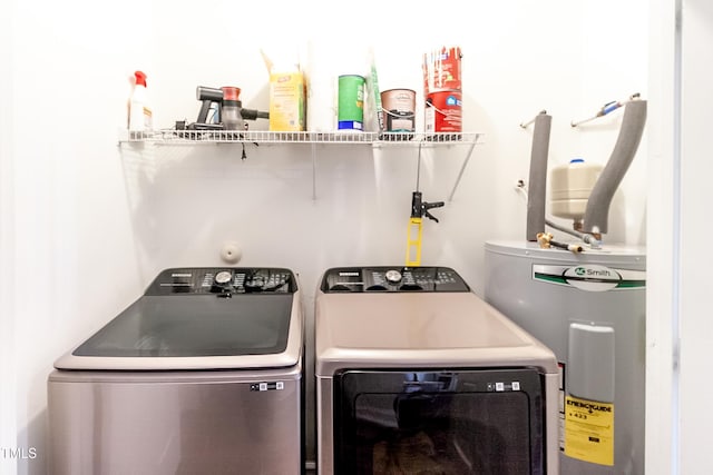 clothes washing area with independent washer and dryer and electric water heater