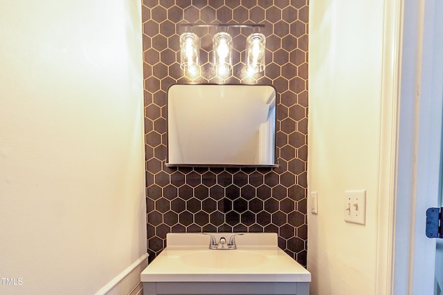 bathroom featuring vanity and decorative backsplash