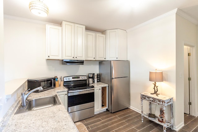 kitchen with sink, ornamental molding, white cabinets, and appliances with stainless steel finishes