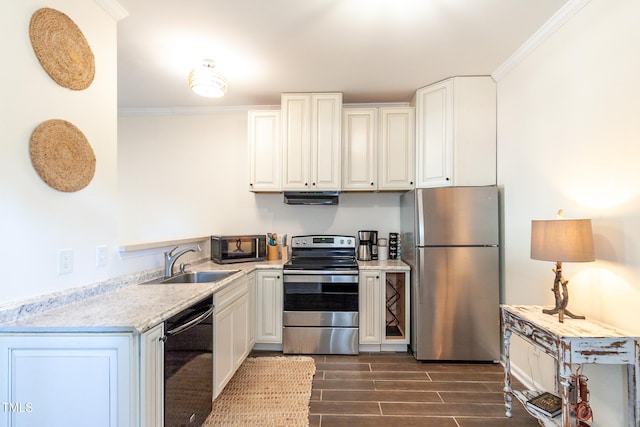 kitchen with white cabinetry, ornamental molding, appliances with stainless steel finishes, and sink