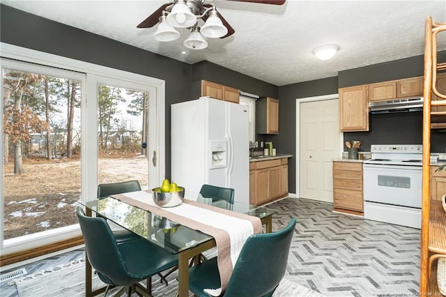 kitchen featuring ceiling fan, white appliances, a textured ceiling, and light brown cabinets