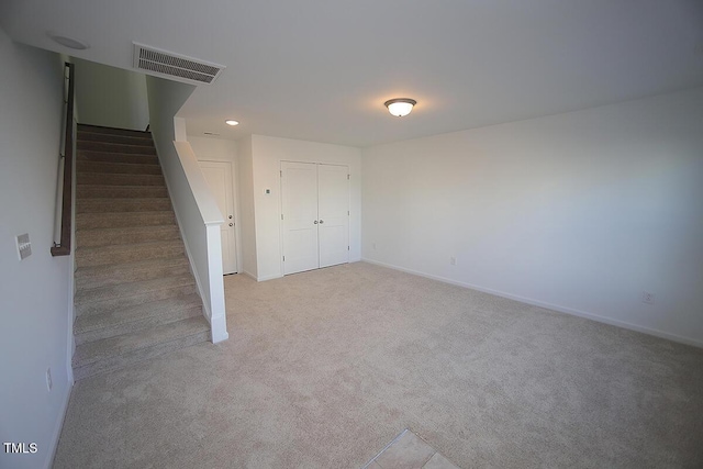 basement with light colored carpet