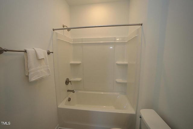 bathroom with toilet and shower / bathing tub combination