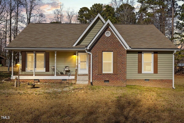 view of front facade featuring a yard and covered porch