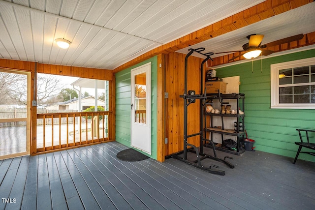 wooden deck featuring ceiling fan