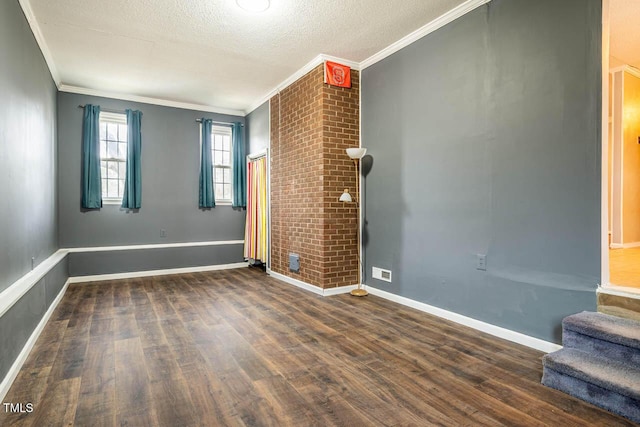 unfurnished room with ornamental molding, a textured ceiling, and dark hardwood / wood-style flooring