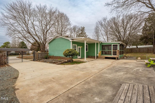 view of front of property with a sunroom