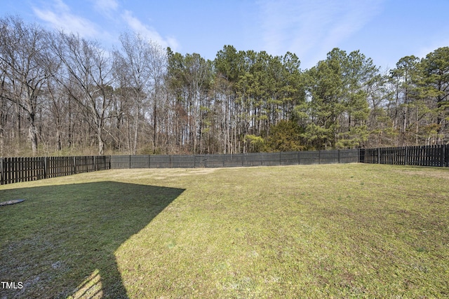 view of yard with a fenced backyard