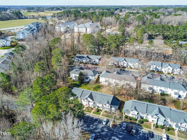 birds eye view of property with a residential view