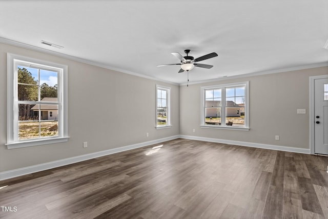 interior space with crown molding, wood-type flooring, and a healthy amount of sunlight