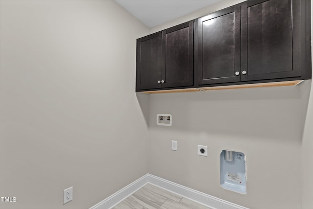 laundry area featuring washer hookup, cabinets, and hookup for an electric dryer