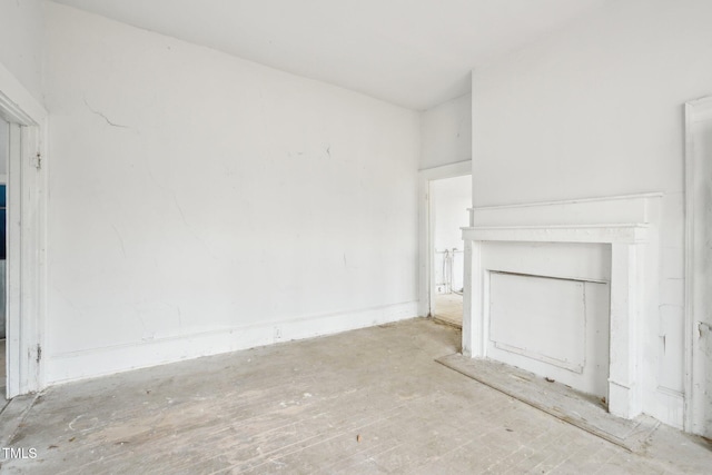 unfurnished living room featuring a fireplace