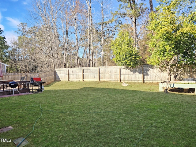 view of yard featuring a patio area and a fenced backyard