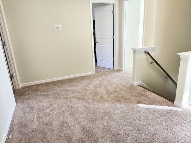 spare room with carpet flooring and baseboards