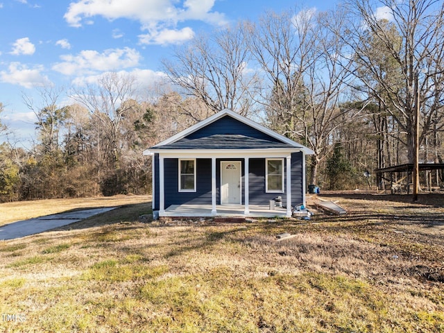 bungalow-style house with a porch and a front lawn