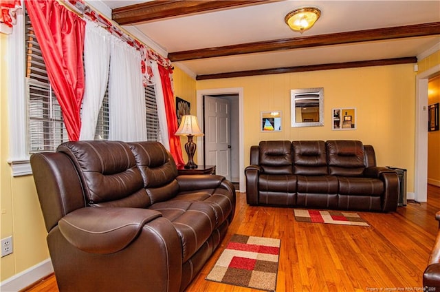 living room with beamed ceiling, crown molding, and hardwood / wood-style floors