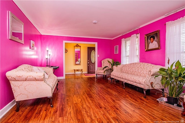 interior space with ornamental molding and hardwood / wood-style floors