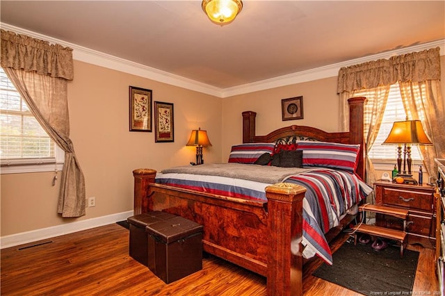 bedroom with ornamental molding and wood-type flooring