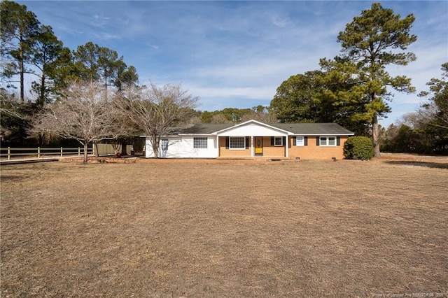 ranch-style house featuring a front lawn