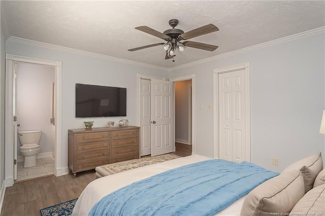 bedroom featuring crown molding, ceiling fan, connected bathroom, and light hardwood / wood-style floors