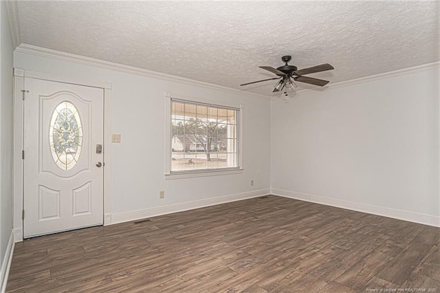 entrance foyer featuring ornamental molding, a textured ceiling, and dark hardwood / wood-style flooring