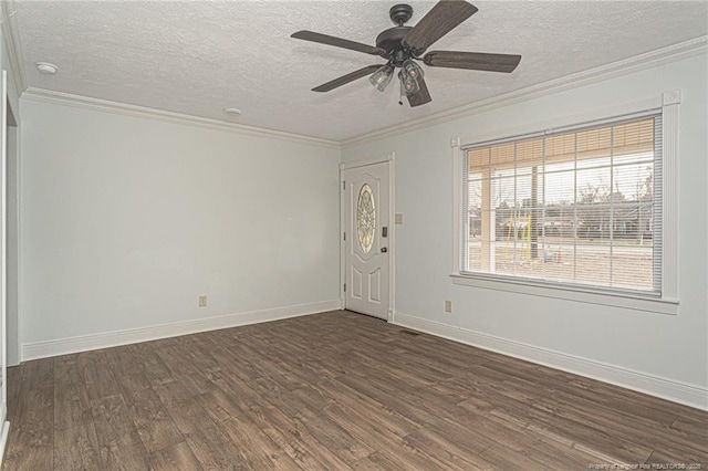 spare room featuring ornamental molding, a textured ceiling, ceiling fan, and dark hardwood / wood-style flooring