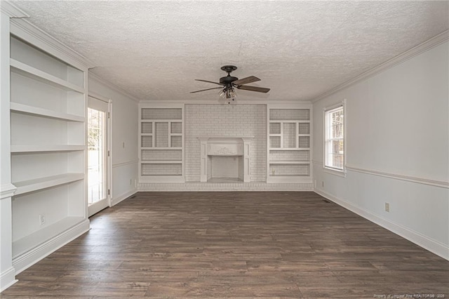 unfurnished living room with dark hardwood / wood-style floors, built in features, a fireplace, ceiling fan, and a textured ceiling