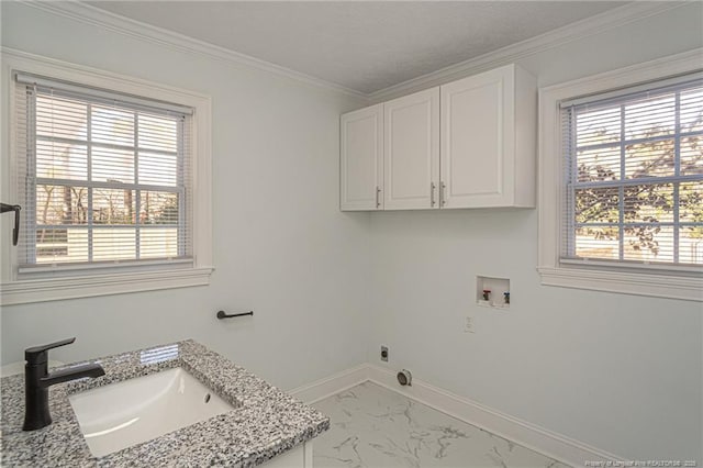 laundry room featuring sink, crown molding, cabinets, hookup for a washing machine, and hookup for an electric dryer