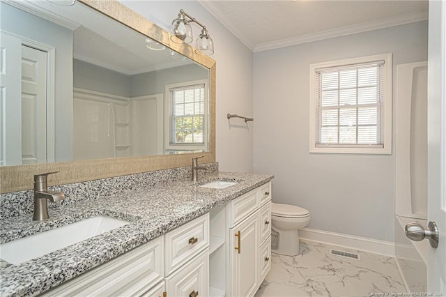 bathroom with ornamental molding, vanity, and toilet