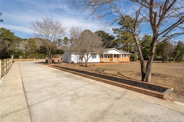 6628 Camden Rd, Fayetteville, NC 28306 - view of front facade with driveway and a porch