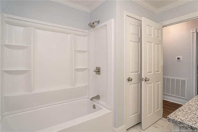 6628 Camden Rd, Fayetteville, NC 28306 - bathroom with marble finish flooring, washtub / shower combination, and crown molding