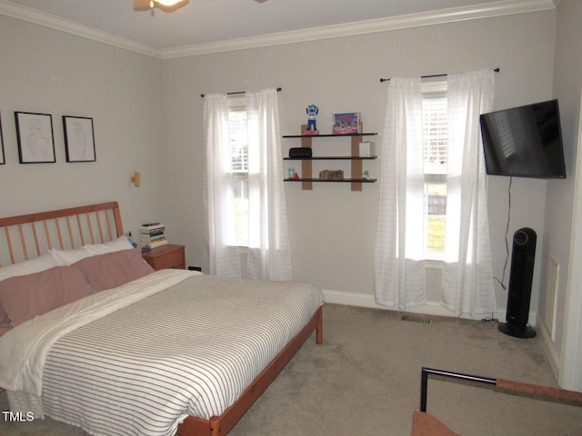 bedroom featuring ornamental molding and carpet flooring