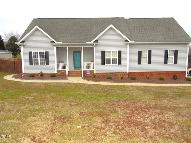 ranch-style home with a front lawn and a porch