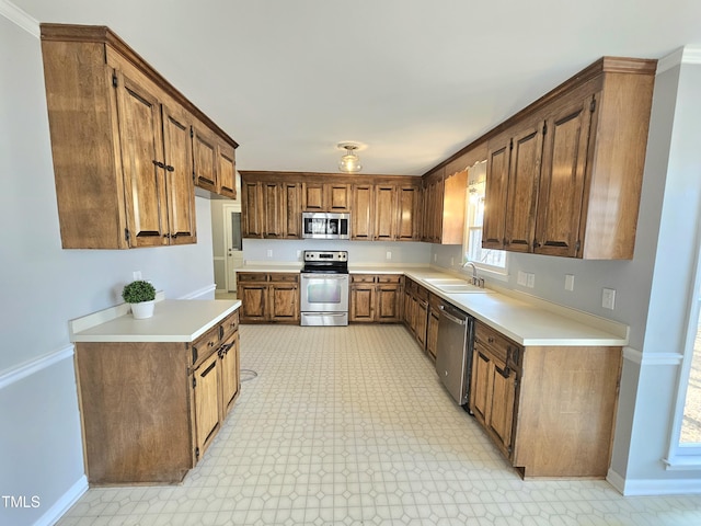 kitchen with sink and appliances with stainless steel finishes