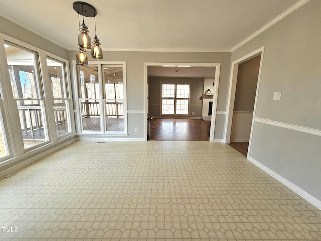 unfurnished dining area with crown molding