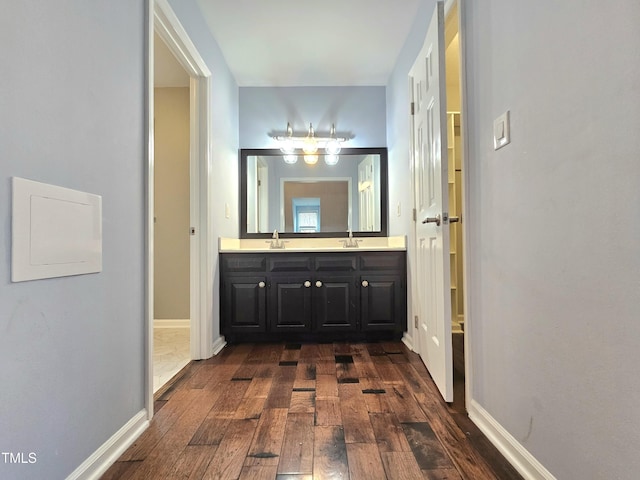 bathroom with vanity and wood-type flooring