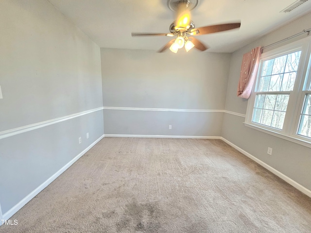 carpeted empty room featuring ceiling fan