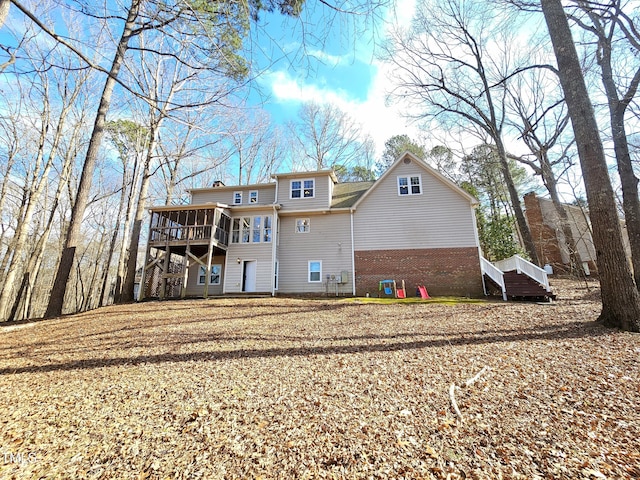 rear view of house with a sunroom