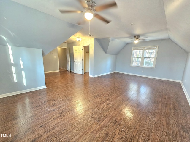 bonus room featuring ceiling fan, dark hardwood / wood-style floors, and vaulted ceiling