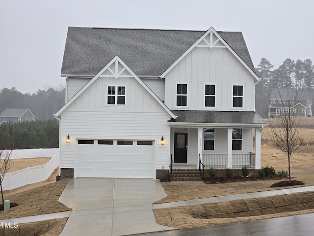 view of front of home with a porch and a garage