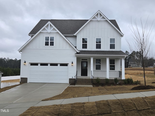 view of front of house featuring a garage and covered porch