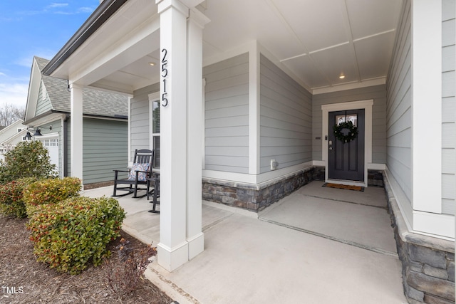 doorway to property featuring a porch