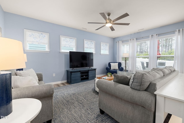 living room featuring hardwood / wood-style flooring and ceiling fan