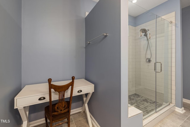 bathroom featuring tile patterned flooring and a shower with door