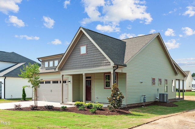 4522 Sweet Williams Ln Unit 163, Wilson, NC 27896 - view of front of house featuring cooling unit, a garage, a front lawn, and a porch